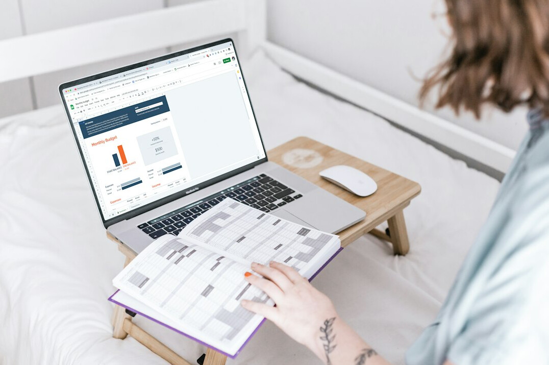 woman tracking expenses on laptop